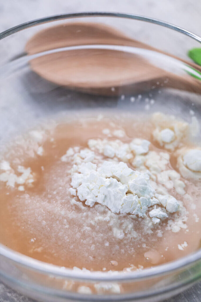 A bowl of mixed ingredients for Salt and Vinegar Chicken Wings recipe.