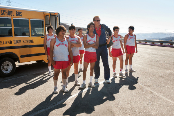 McFARLAND, USA..L to R: Jose Cardenas (Johnny Ortiz), Danny Diaz (Ramiro Rodriguez), Thomas Valles (Carlos Pratts), Victor Puentes (Sergio Avelar), Damacio Diaz (Michael Aguero), Coach Jim White (Kevin Costner), Johnny Sameniego (Hector Duran) and David Diaz (Rafael Martinez)..Ph: Ron Phillips..?Disney 2015