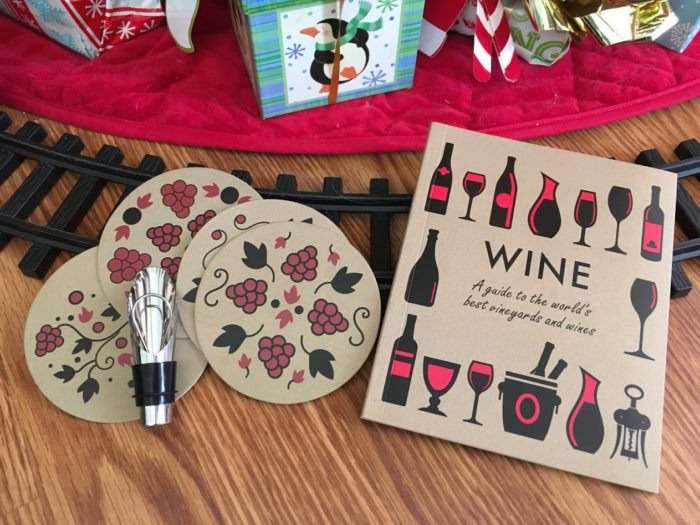 The Wine Gift & Book Set is the perfect companion for wine lovers. Inside the comprehensive book you'll discover a detailed introduction to the regional styles and varieties of vineyards and grapes from around the globe. This set also includes a handy wine pourer for expertly poured wine and 4 beautifully designed coasters. So pour yourself a glass of red or white from your new favorite region and savor the taste.