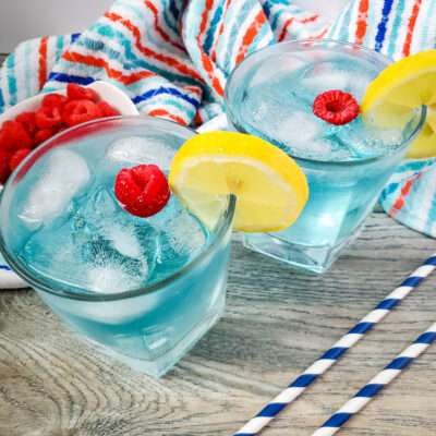 This blue island drink is one of my favorite cocktail recipes, and is super easy to make. This vodka and coconut rum cocktail is perfect for a hot summer day!