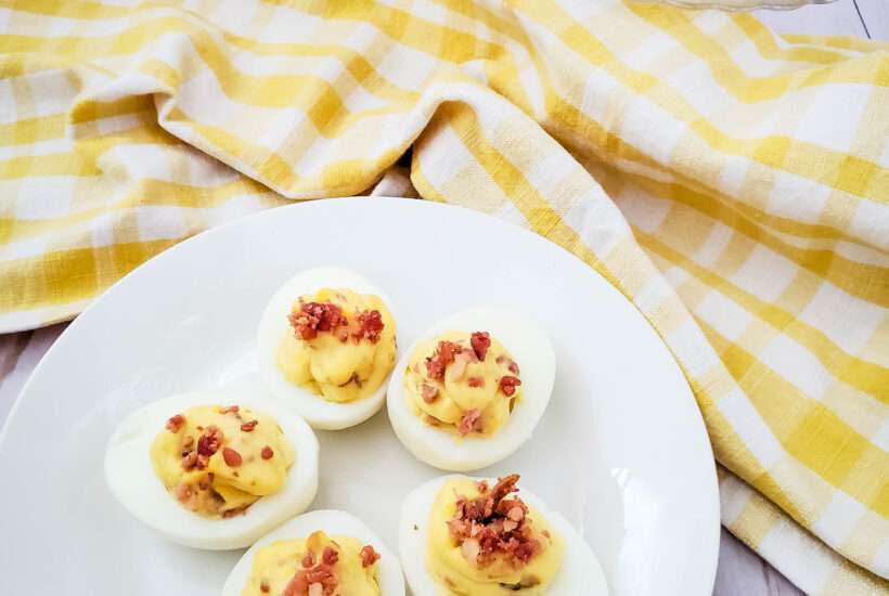 This is simply the best deviled eggs with bacon recipe you will ever try! It is a family favorite, and one of the most requested party side dishes anytime I host or attend.