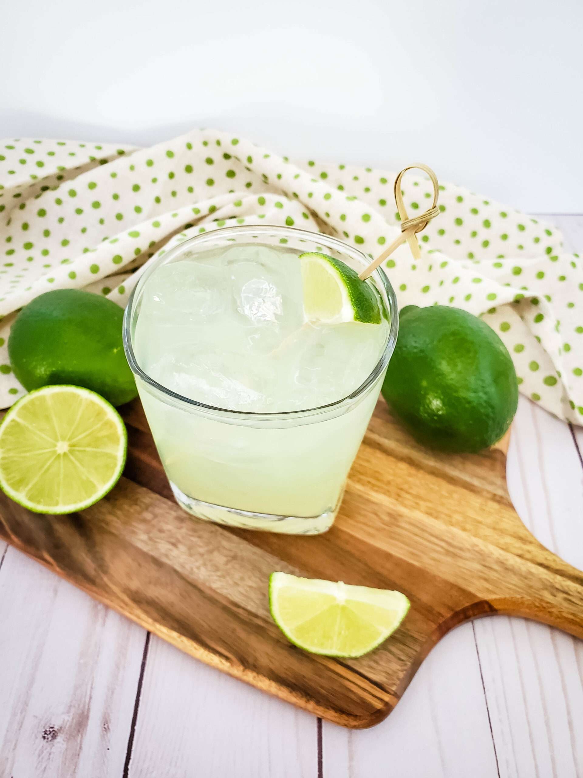 margarita with limes surrounding it