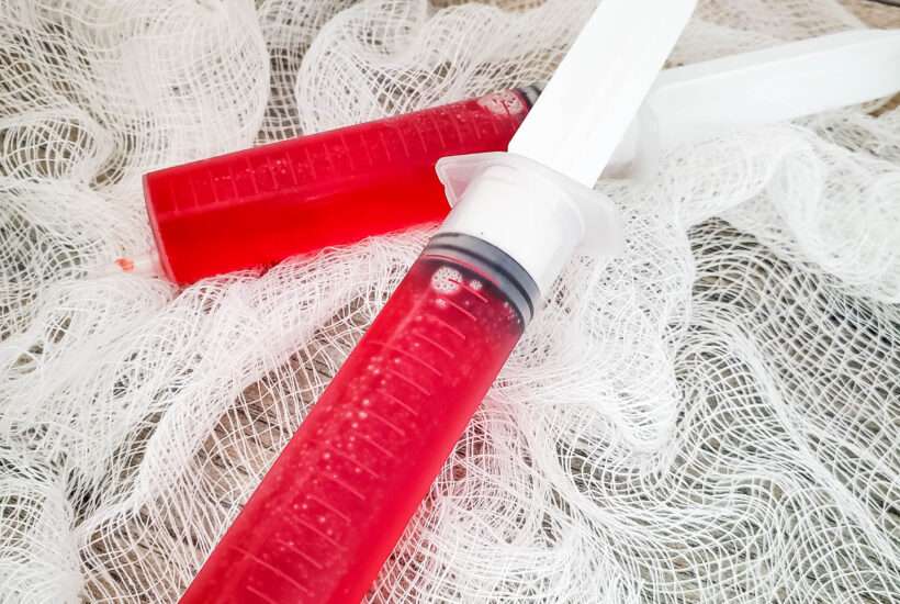 red jello syringe shots up close