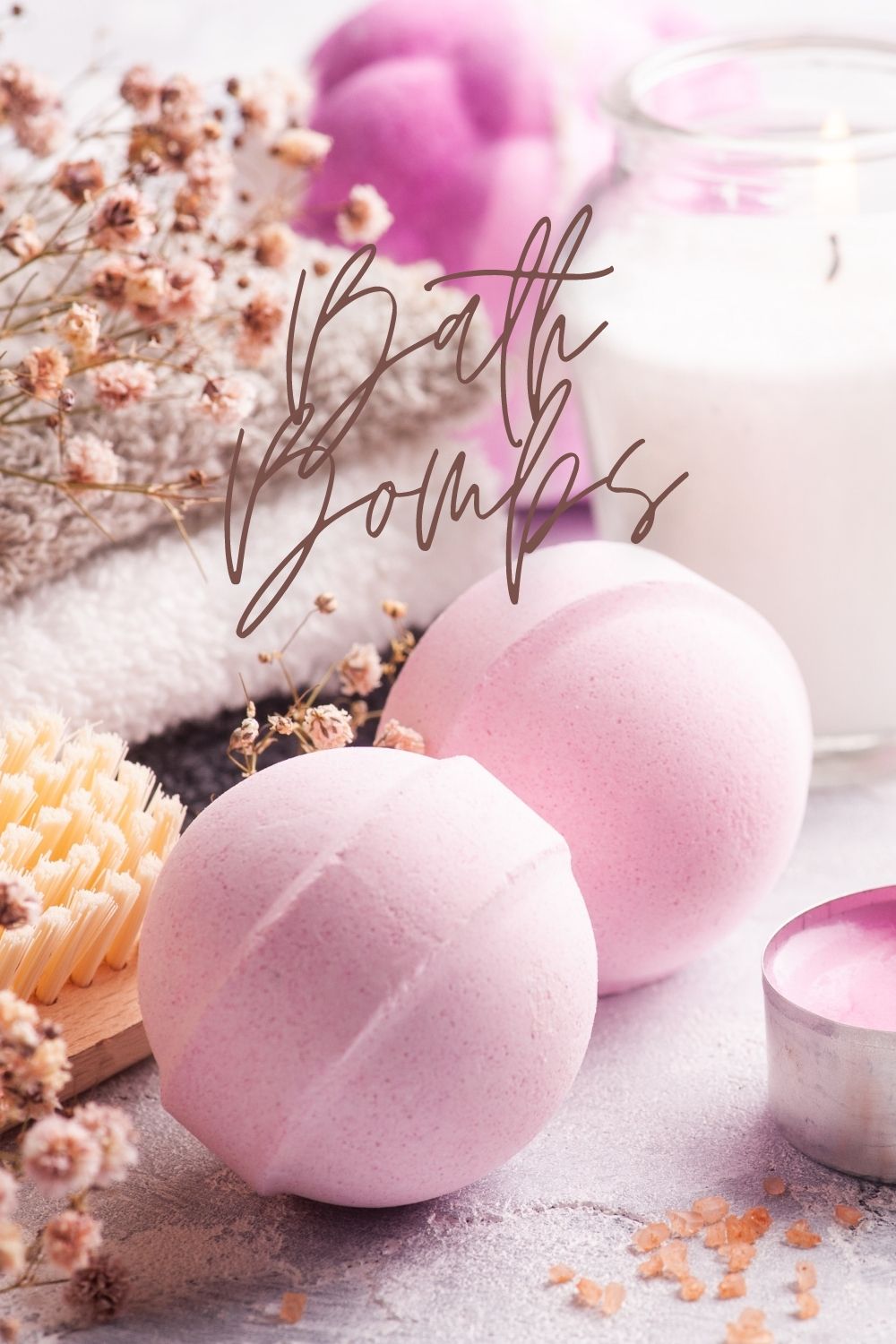 bath bombs with candle, and towels