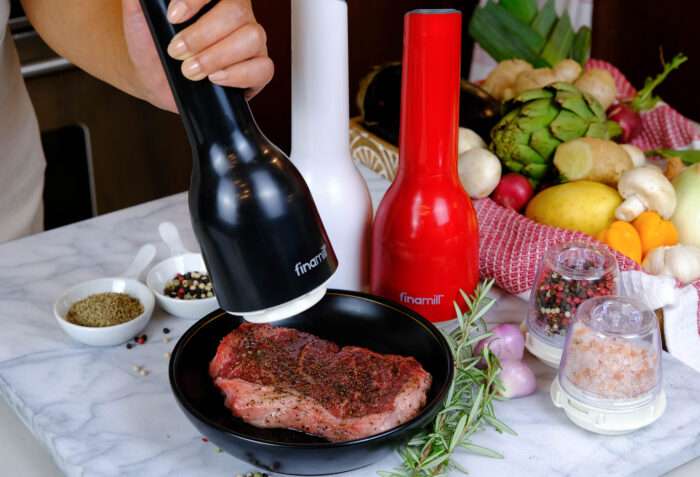 FinaMill in use, spicing up a steak