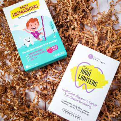 dental probitics from Smile Brilliant Coupon on brown shredded paper