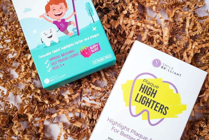 dental probitics from Smile Brilliant Coupon on brown shredded paper