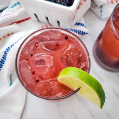 Blackberry Whiskey Lemonade with colorful towel