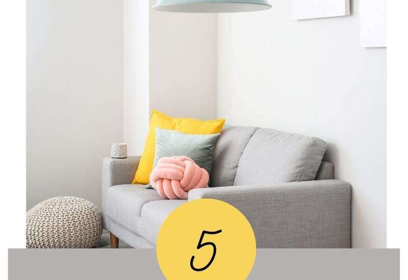 lighting designs over a couch with pillows