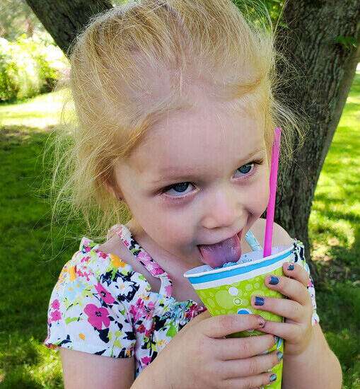 granddaughter enjoying homemade snow cone