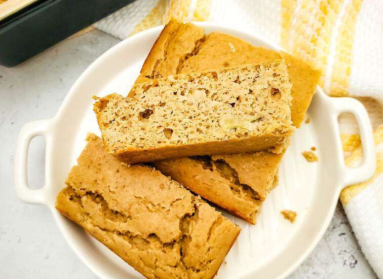 Protein Banana Bread on plate with yellow napkin