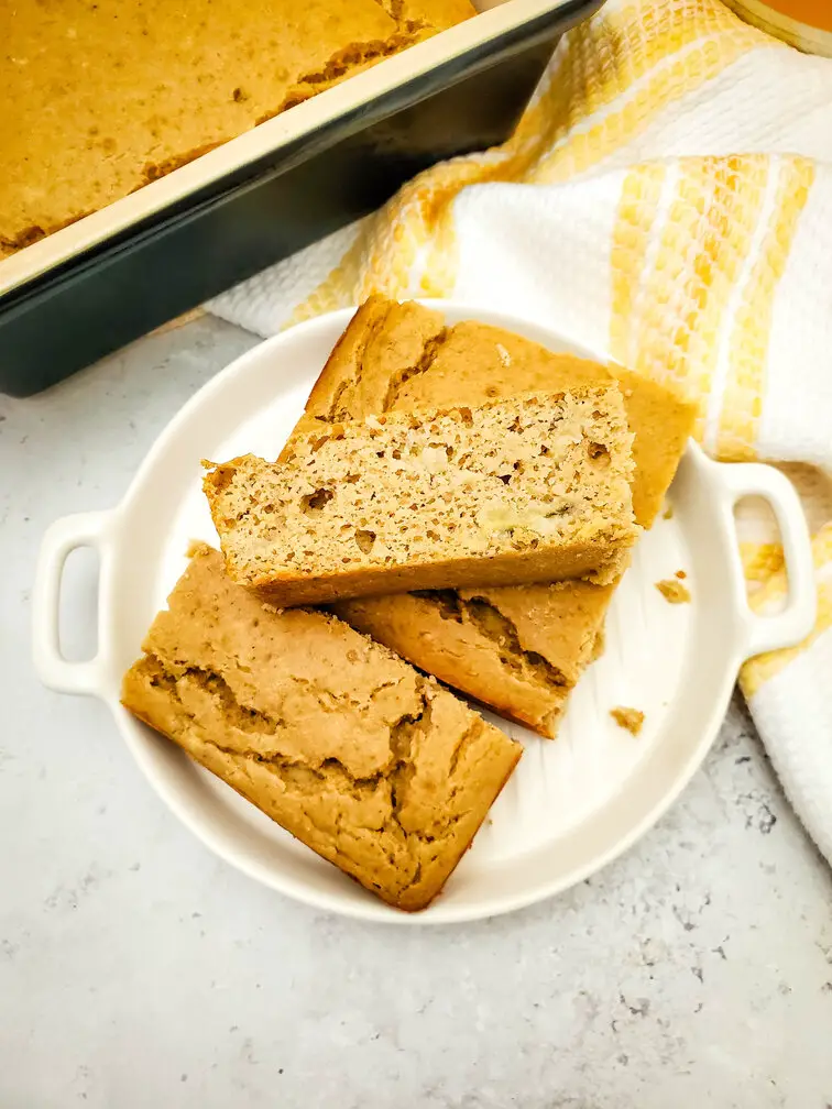 Protein Banana Bread on plate with yellow napkin