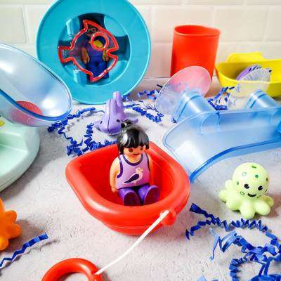 Bath toys - girl in boat and octopus