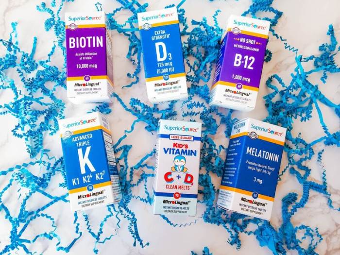 Superior Source Vitamins assortment in packaging in blue paper scraps