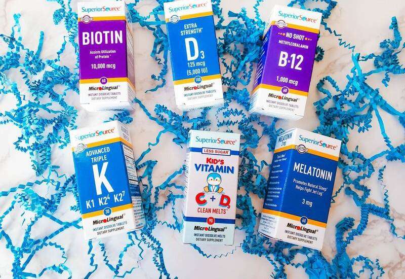 Superior Source Vitamins assortment in packaging in blue paper scraps