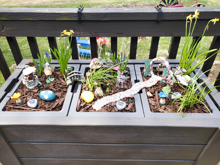 fairy garden with fairies and accessories