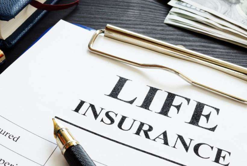 paper with life insurance written on it with a pen