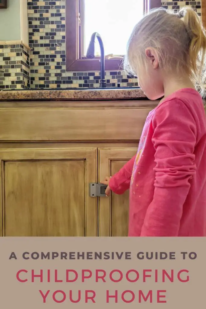 child touching sink cabinet with Door Guardian lock on it