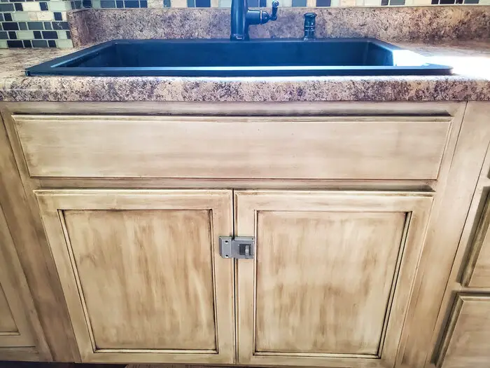 kitchen sink and cabinet with Door Guardian Stash Lock attached