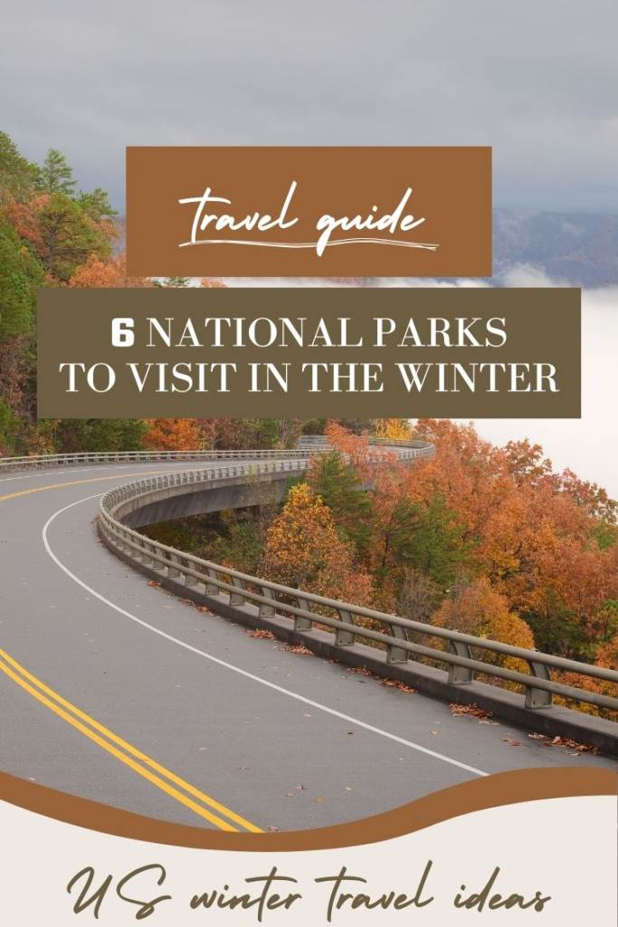 text: travel guide road with fall foliage and a lake 
winter vacation spots united states