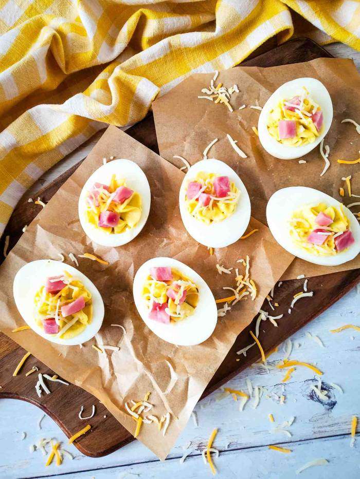 Ham and Cheese Deviled Eggs on brown parchment paper