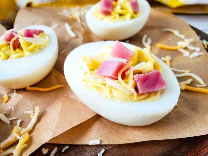 Ham and Cheese Deviled Eggs on brown parchment paper