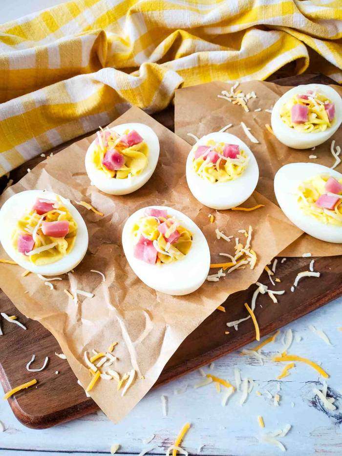 Ham and Cheese Deviled Eggs on brown parchment paper