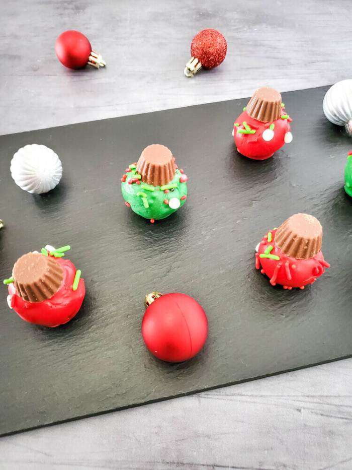 oreo christmas ornaments on a black tray