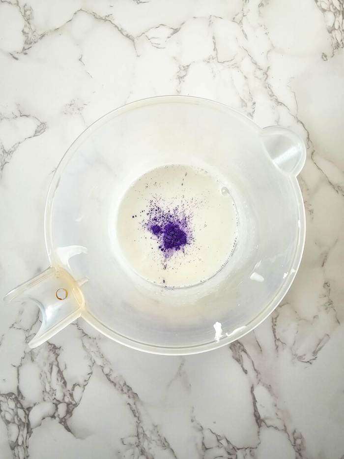 adding purple to the melted soap base