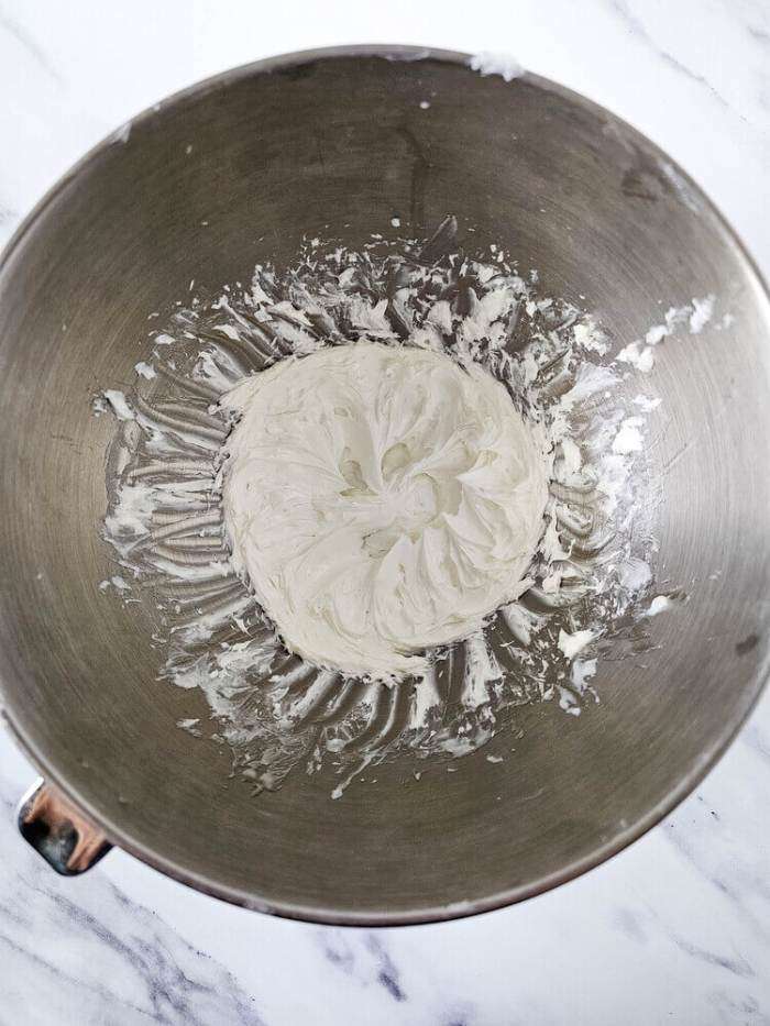 whipped ingredients in a metal bowl