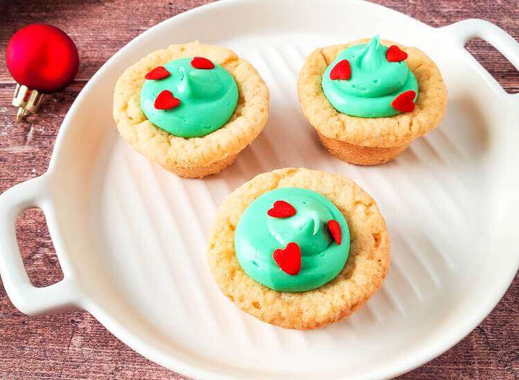 Grinch Sugar Cookies Cups on a white plate