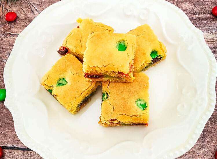 - Holiday M&Ms Cake Mix Cookie Bars on a white plate
