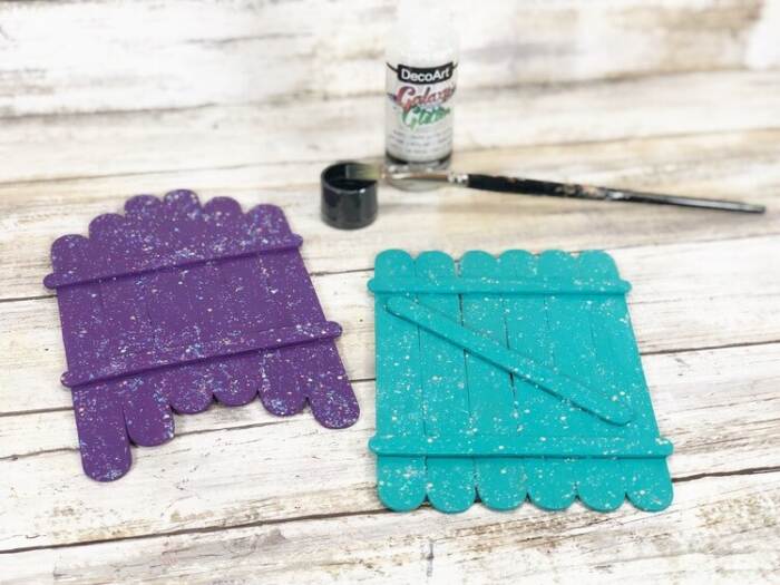 fairy doors painted with purple and blue