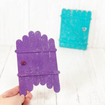 diy fairy doors in 2 designs, one in someone's hand