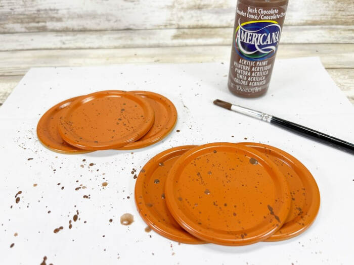 adding brown paint to create depth
