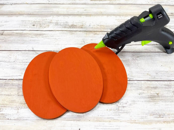 glueing the dark pumpkin pieces together