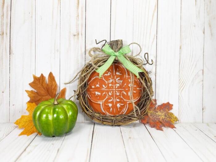 Dollar Tree Pumpkin Craft styled with green pumpkin and leaves