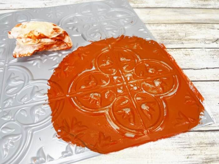 painting the tin to have the orange pumpkin look