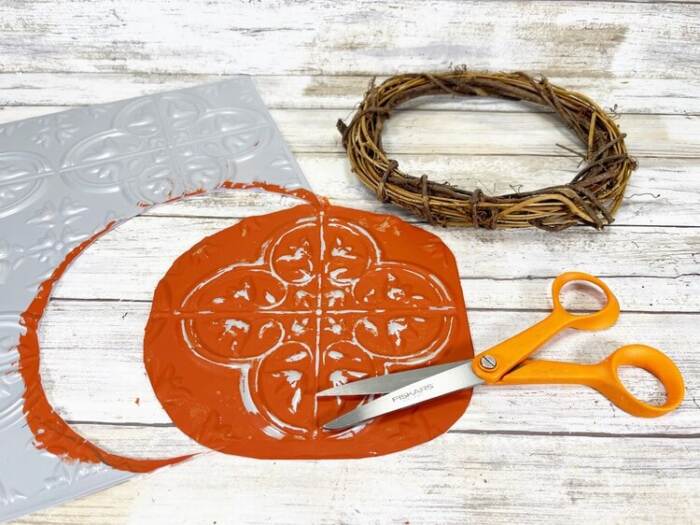 cutting the tin to fit the wreath