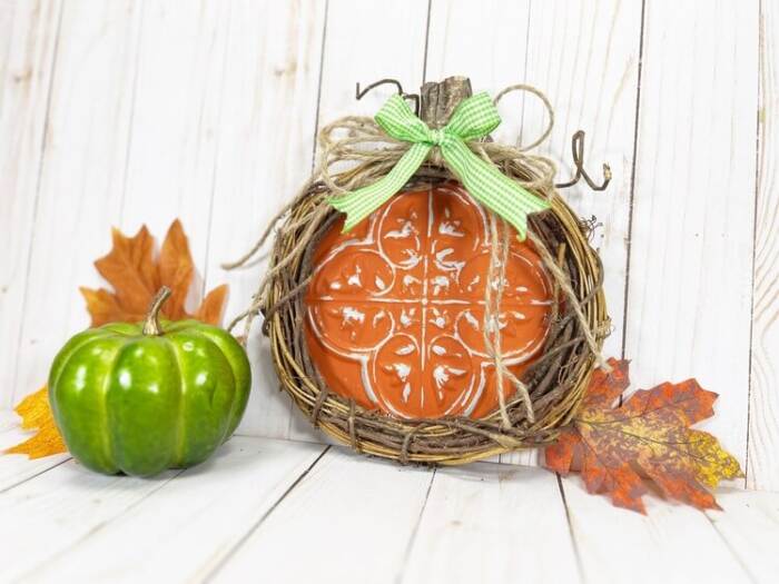Dollar Tree Pumpkin Craft styled with green pumpkin and leaves