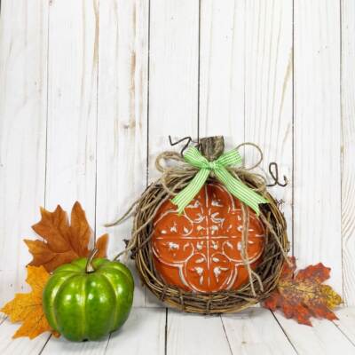 Dollar Tree Pumpkin Craft styled with green pumpkin and leaves