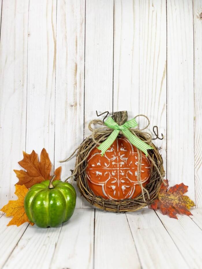 Dollar Tree Pumpkin Craft styled with green pumpkin and leaves
