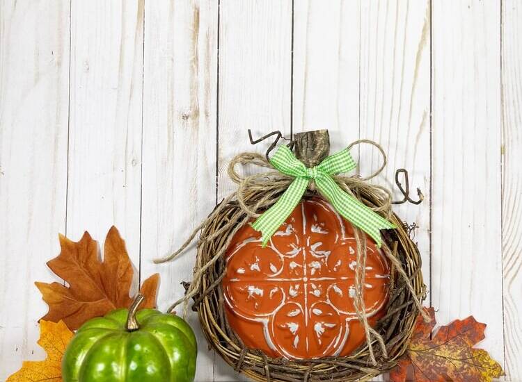 Dollar Tree Pumpkin Craft styled with green pumpkin and leaves