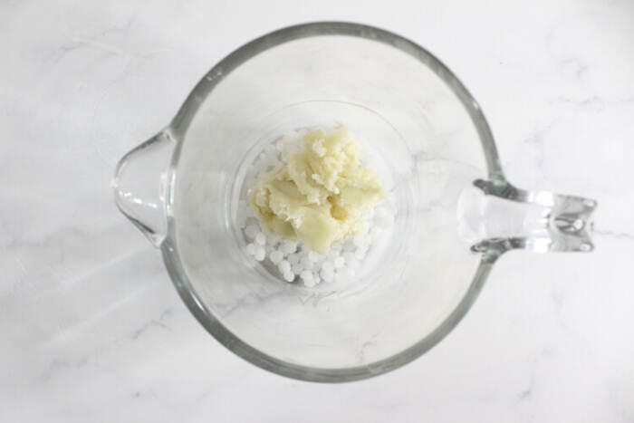 adding the ingredients into a glass jar