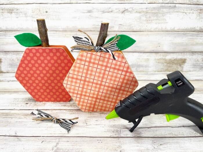 adding the ribbons to the Hexagon Pumpkin Craft Activity