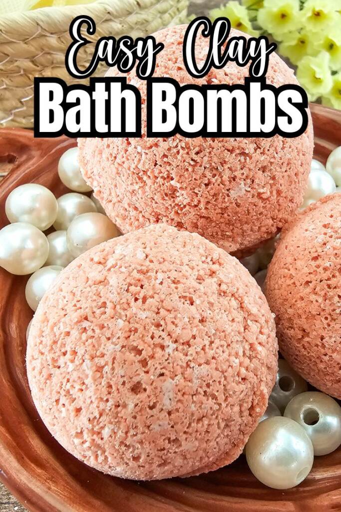 teext: easy clay bath bombs
pink bath bombs in brown dish with pearls