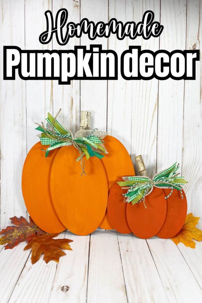 Text: homemade pumpkin decor - orang pumpkin craft on wood board