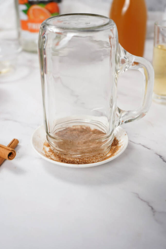 dipping the rim of the glass in cinnamon