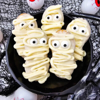 Mummy Nutter Butters on a black plate