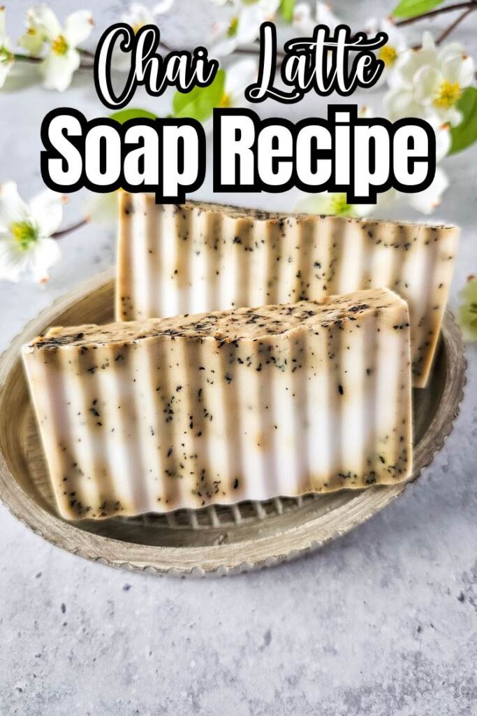 text: chai latte soap recipe - soap in dish on grey counter with flower in background